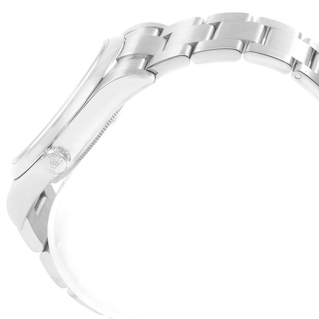 This side view shows the bracelet and crown of the Rolex Oyster Perpetual 114300 Men
s Stainless Steel Blue Dial 114300 Men
s Stainless Steel Blue Dial watch.