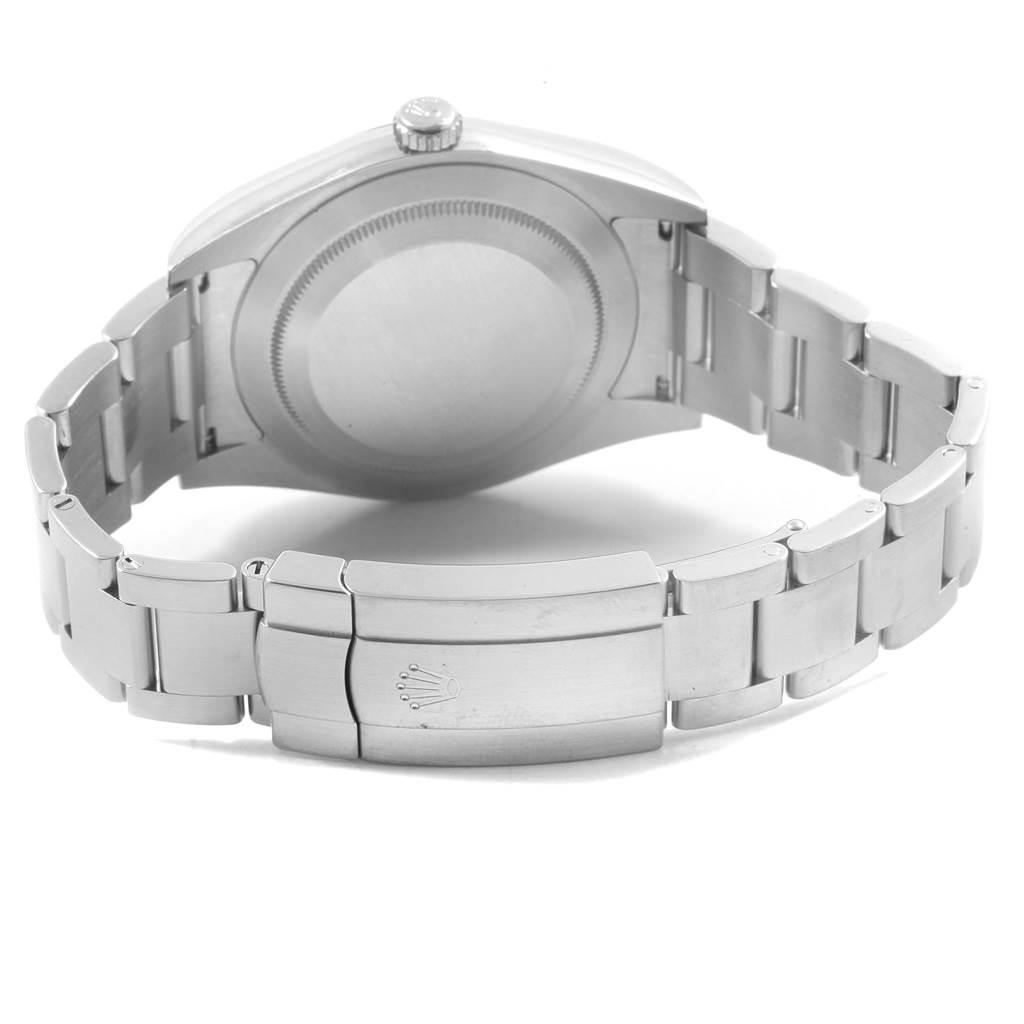 The image shows the back view of a Rolex Oyster Perpetual 114300 Men
s Stainless Steel Blue Dial 114300 Men
s Stainless Steel Blue Dial watch, highlighting the case back and the metal bracelet with a clasp.