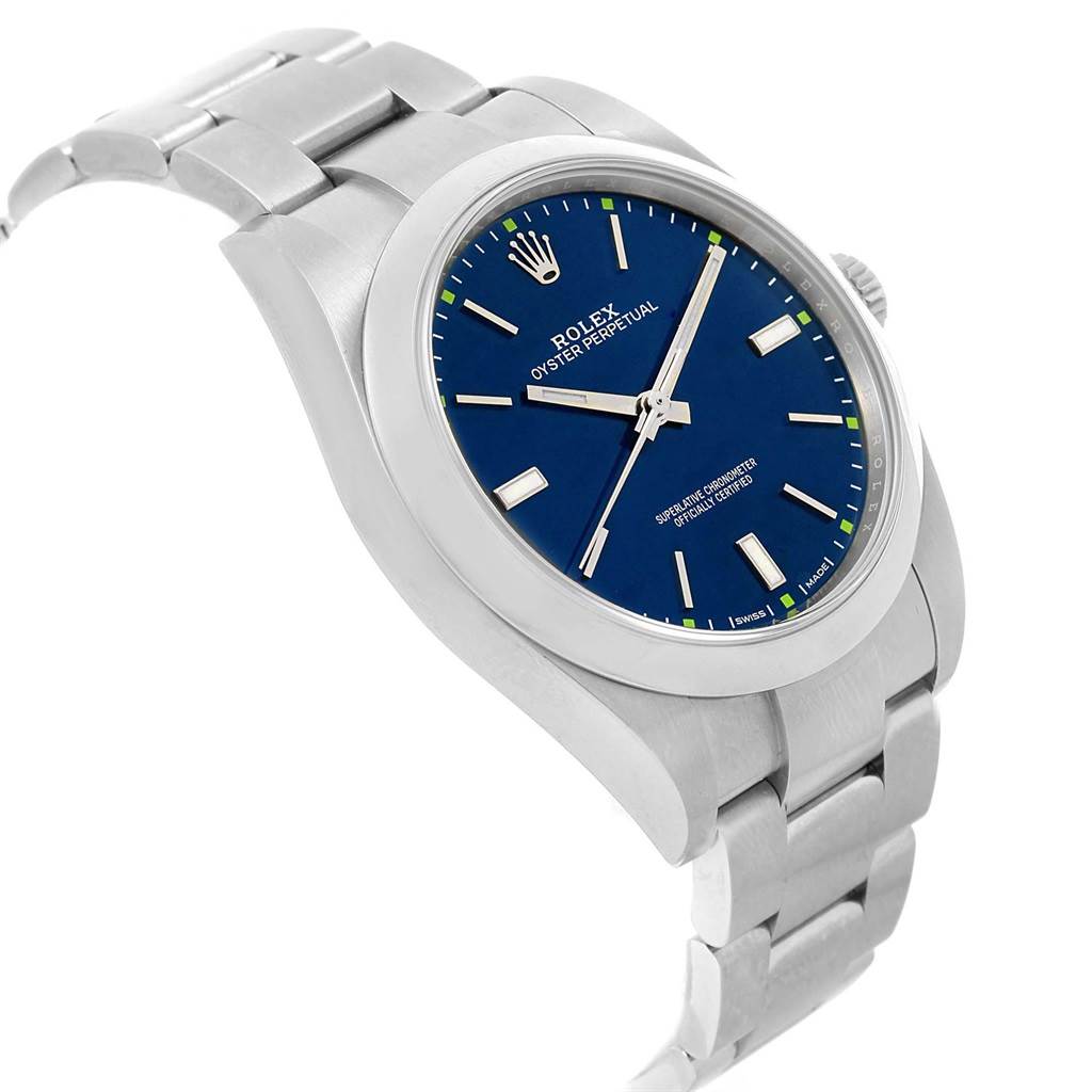 The image shows a side angle of the Rolex Oyster Perpetual 114300 Men
s Stainless Steel Blue Dial 114300 Men
s Stainless Steel Blue Dial watch, displaying the watch face, case, and part of the bracelet.