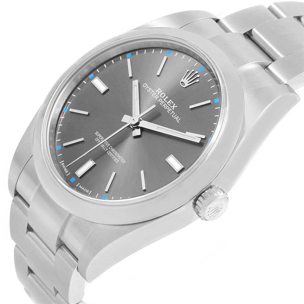 The image shows an angled view of a Rolex Oyster Perpetual 114300 Men
s Stainless Steel Grey Dial 114300 Men
s Stainless Steel Grey Dial watch, highlighting its dial, case, bracelet, and crown.