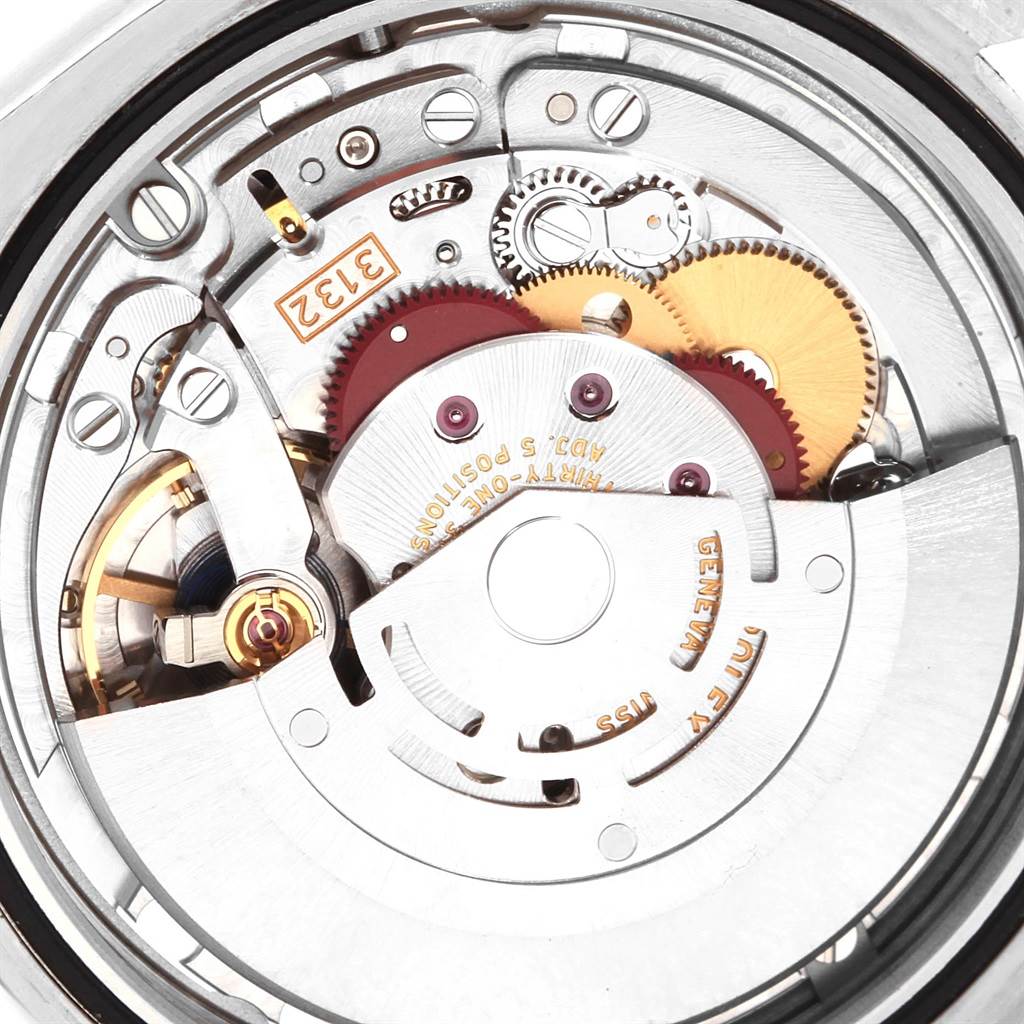The image shows a close-up view of the internal movement mechanism of a Rolex Oyster Perpetual 114300 Men
s Stainless Steel Grey Dial 114300 Men
s Stainless Steel Grey Dial watch.