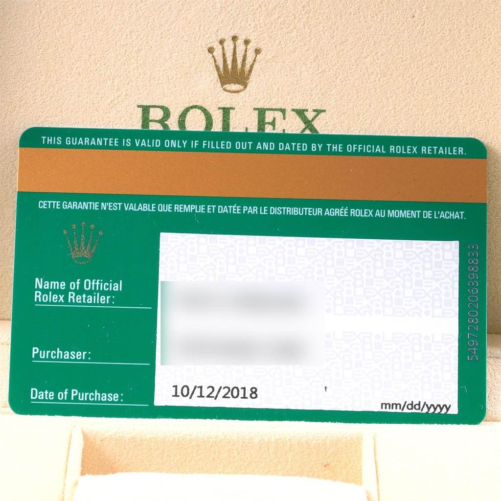 The image shows the warranty card of a Rolex Oyster Perpetual 114200 Men
s Stainless Steel Burgundy Dial 114200 Men
s Stainless Steel Burgundy Dial model, with retailer and purchase information.