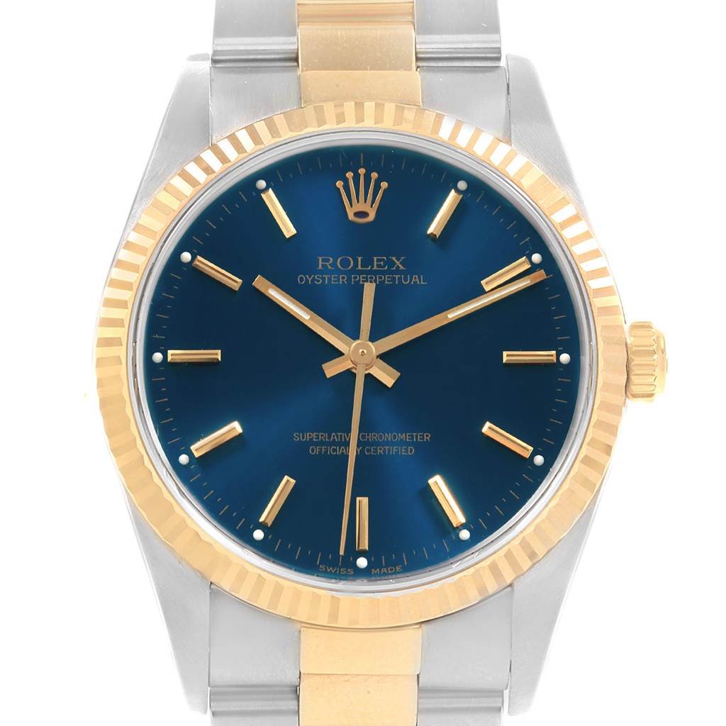 The image shows a frontal view of the Rolex Oyster Perpetual 14233 Men's Steel and Gold (two tone) Blue Dial 14233 Men's Steel and Gold (two tone) Blue Dial watch, highlighting its blue dial, gold markers, and two-tone bracelet.
