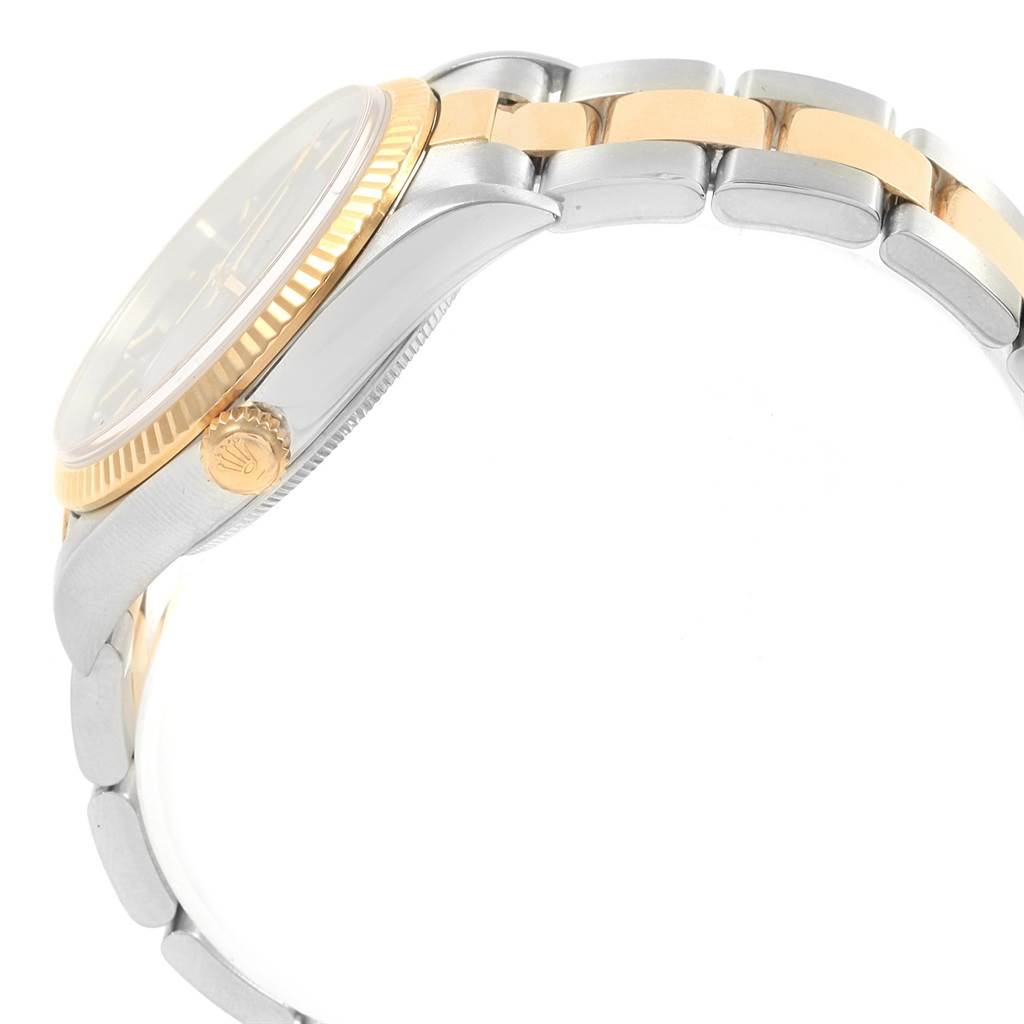 The image shows a side view of a Rolex Oyster Perpetual 14233 Men's Steel and Gold (two tone) Blue Dial 14233 Men's Steel and Gold (two tone) Blue Dial watch, highlighting the crown, case, and part of the bracelet.