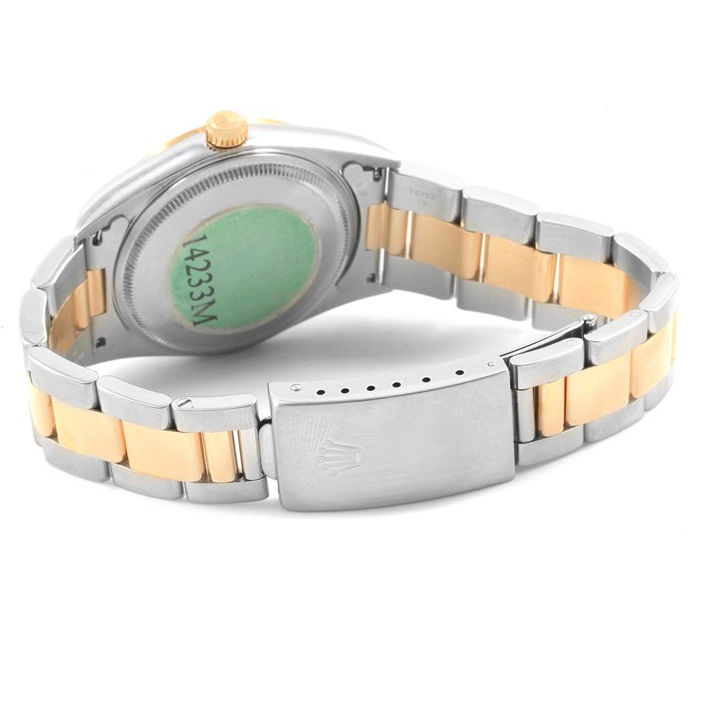 This image shows the back case and clasp of the Rolex Oyster Perpetual 14233 Men's Steel and Gold (two tone) Blue Dial 14233 Men's Steel and Gold (two tone) Blue Dial watch.