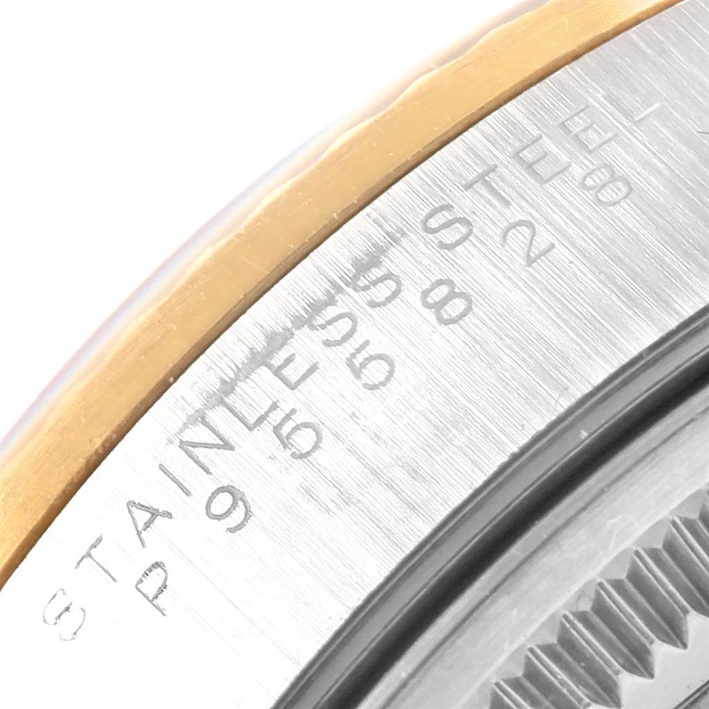 This image shows a close-up angle of a Rolex Oyster Perpetual 14233 Men's Steel and Gold (two tone) Blue Dial 14233 Men's Steel and Gold (two tone) Blue Dial model, highlighting the stainless steel case and engravings.