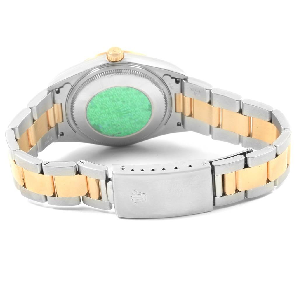 This image shows the back view of the Rolex Oyster Perpetual 14233 Men's Steel and Gold (two tone) Black Dial 14233 Men's Steel and Gold (two tone) Black Dial watch, including its case back and two-tone bracelet with the clasp.