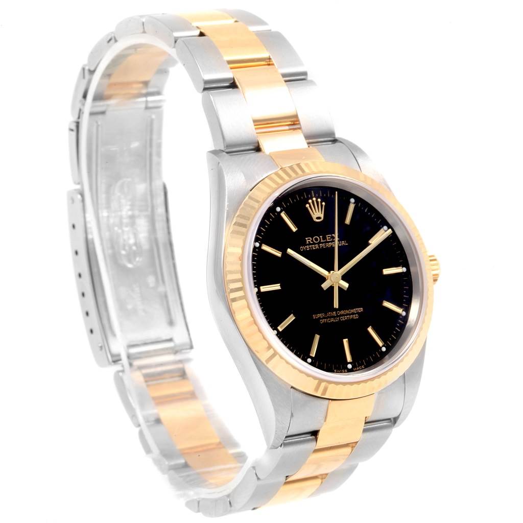 The Rolex Oyster Perpetual 14233 Men's Steel and Gold (two tone) Black Dial 14233 Men's Steel and Gold (two tone) Black Dial watch is shown at a 3/4 angle, highlighting its black dial, gold bezel, and two-tone bracelet.
