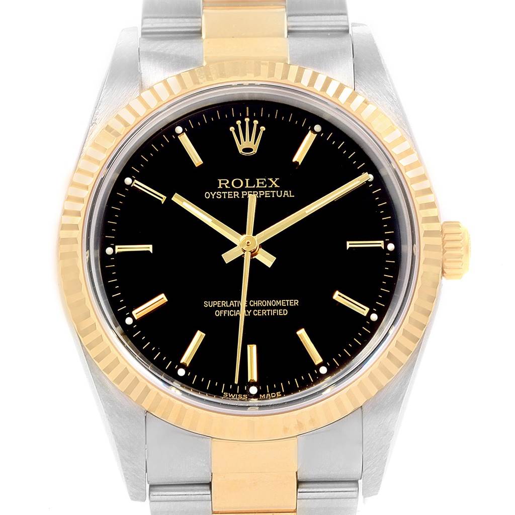 The image shows a frontal view of the Rolex Oyster Perpetual 14233 Men's Steel and Gold (two tone) Black Dial 14233 Men's Steel and Gold (two tone) Black Dial watch, displaying the bezel, dial, hands, and part of the bracelet.