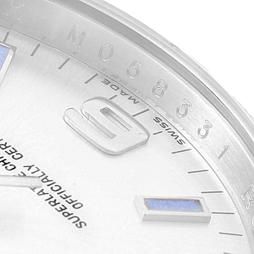 This image shows a close-up of the dial and hour markers of a Rolex Oyster Perpetual 114210 Men
s Stainless Steel Silver Dial 114210 Men
s Stainless Steel Silver Dial watch.