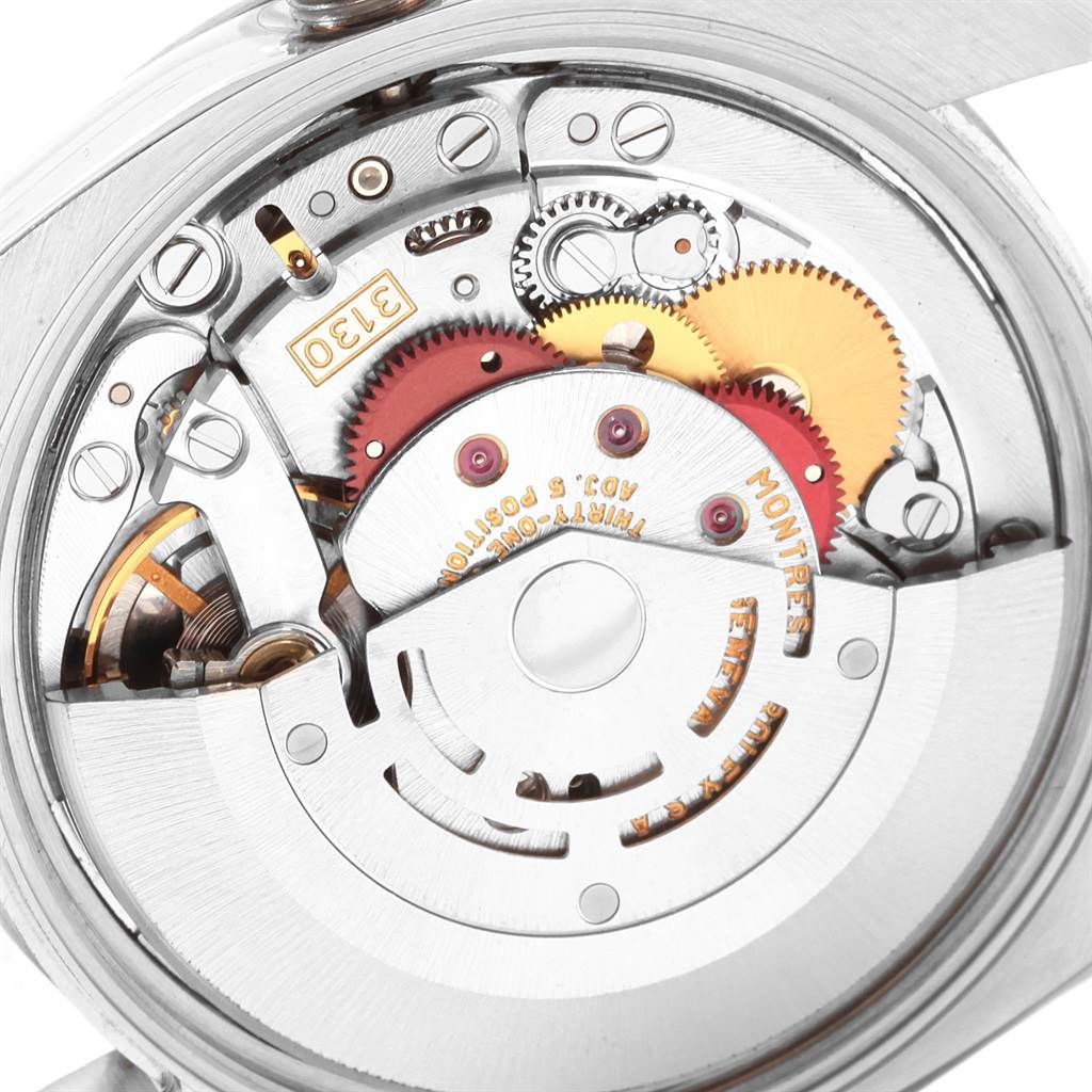 This close-up image shows the intricate movement mechanism of a Rolex Oyster Perpetual 114210 Men
s Stainless Steel Silver Dial 114210 Men
s Stainless Steel Silver Dial watch.