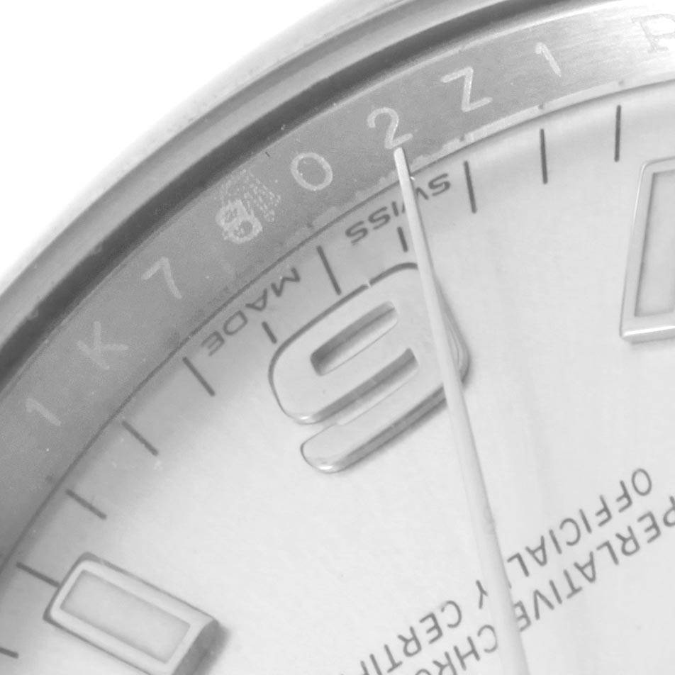 The image shows a close-up of the dial and bezel of a Rolex Oyster Perpetual 114200 Men's Stainless Steel Silver Dial 114200 Men's Stainless Steel Silver Dial watch, focusing on the numeral 9 and minute markers.