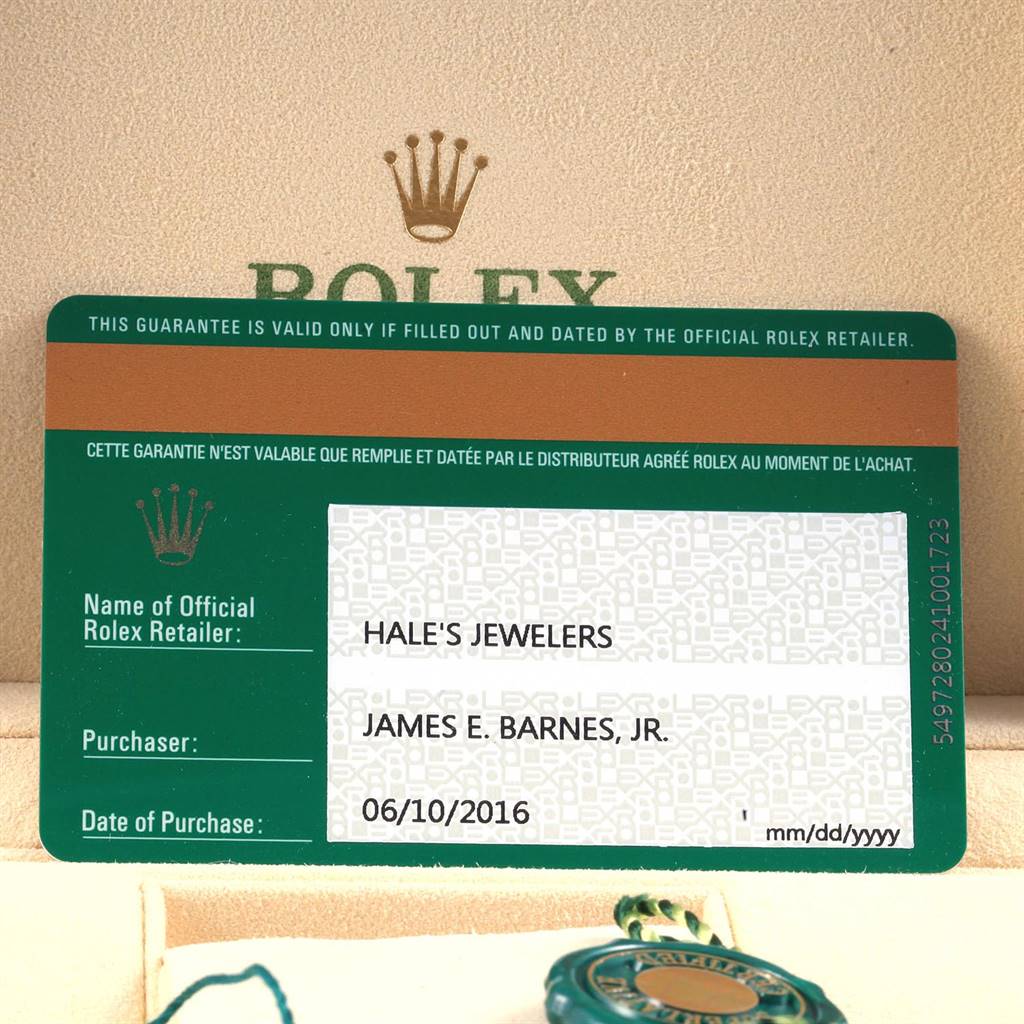 The image shows the guarantee card and green tag for a Rolex Oyster Perpetual 114200 Men's Stainless Steel Silver Dial 114200 Men's Stainless Steel Silver Dial watch, highlighting the official retailer and purchase details.