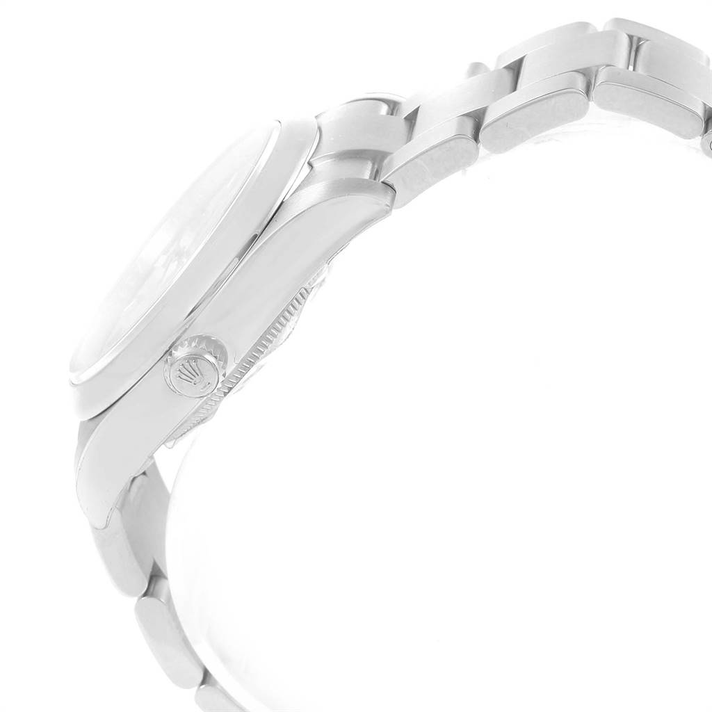 This image shows a side view of a Rolex Oyster Perpetual 114200 Men's Stainless Steel Silver Dial 114200 Men's Stainless Steel Silver Dial watch, highlighting the crown and bracelet.