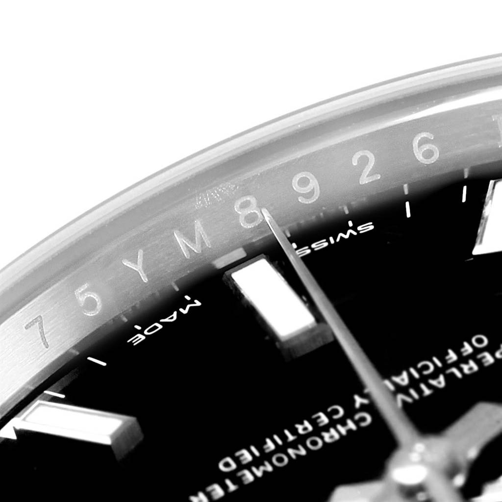 This close-up image shows the dial and second hand of a Rolex Oyster Perpetual 114200 Men's Stainless Steel Black Dial 114200 Men's Stainless Steel Black Dial watch.