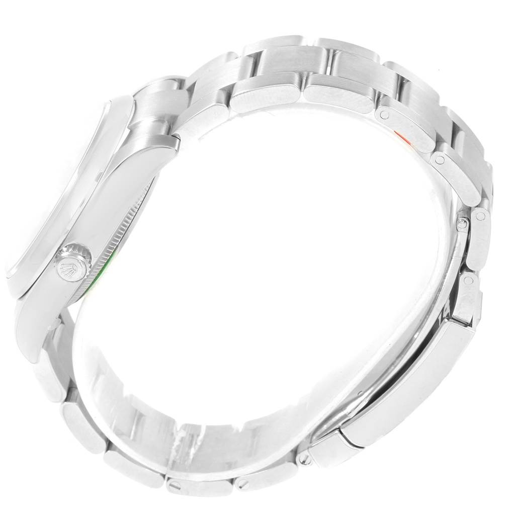 The image shows a side profile of a Rolex Oyster Perpetual 114200 Men's Stainless Steel Black Dial 114200 Men's Stainless Steel Black Dial watch, highlighting the bracelet and crown.