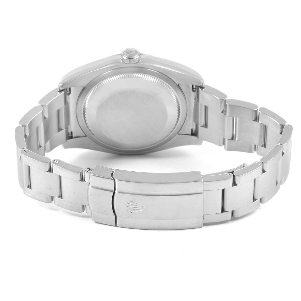 This image shows the back case and clasp of the Rolex Oyster Perpetual 116000 Men
s Stainless Steel Blue Dial 116000 Men
s Stainless Steel Blue Dial watch.