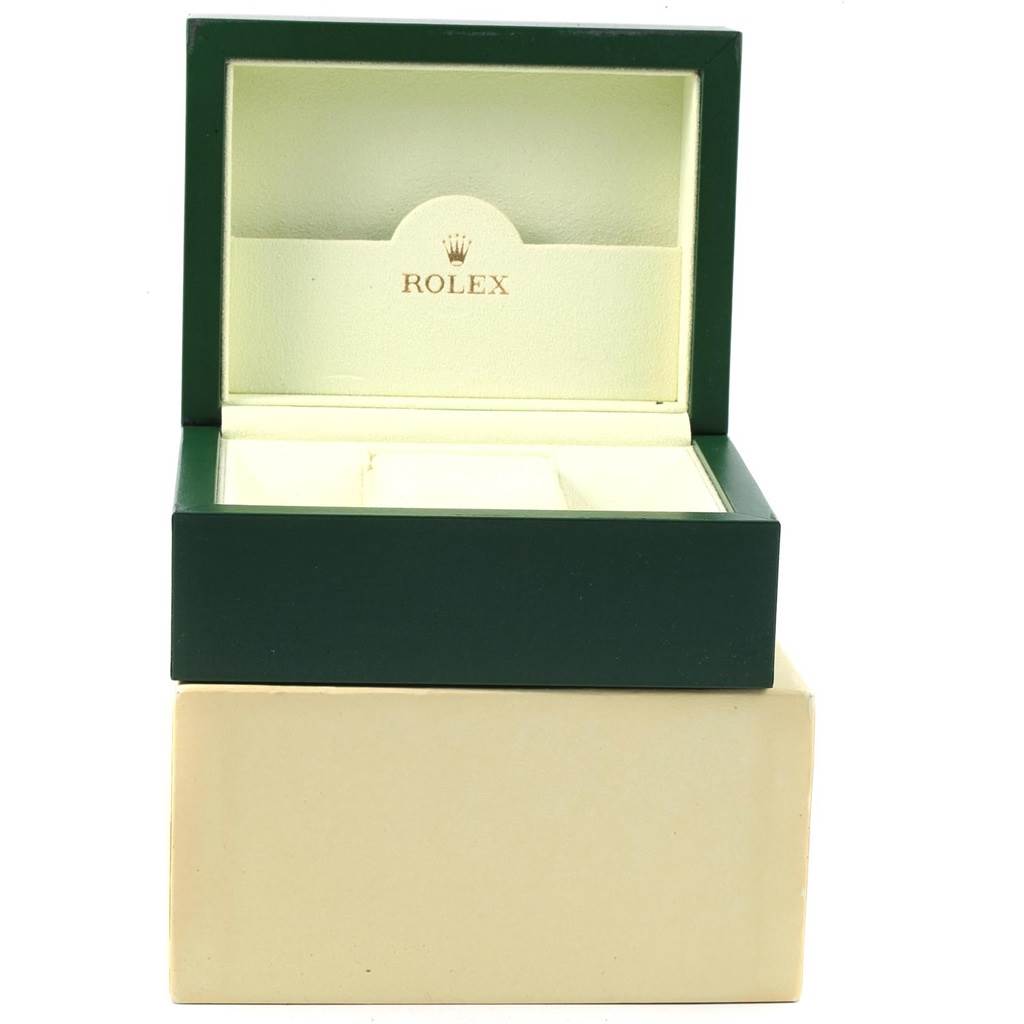 This image shows an open Rolex Oyster Perpetual 116000 Men
s Stainless Steel Blue Dial 116000 Men
s Stainless Steel Blue Dial watch box from a front angle, highlighting the interior and the Rolex logo.