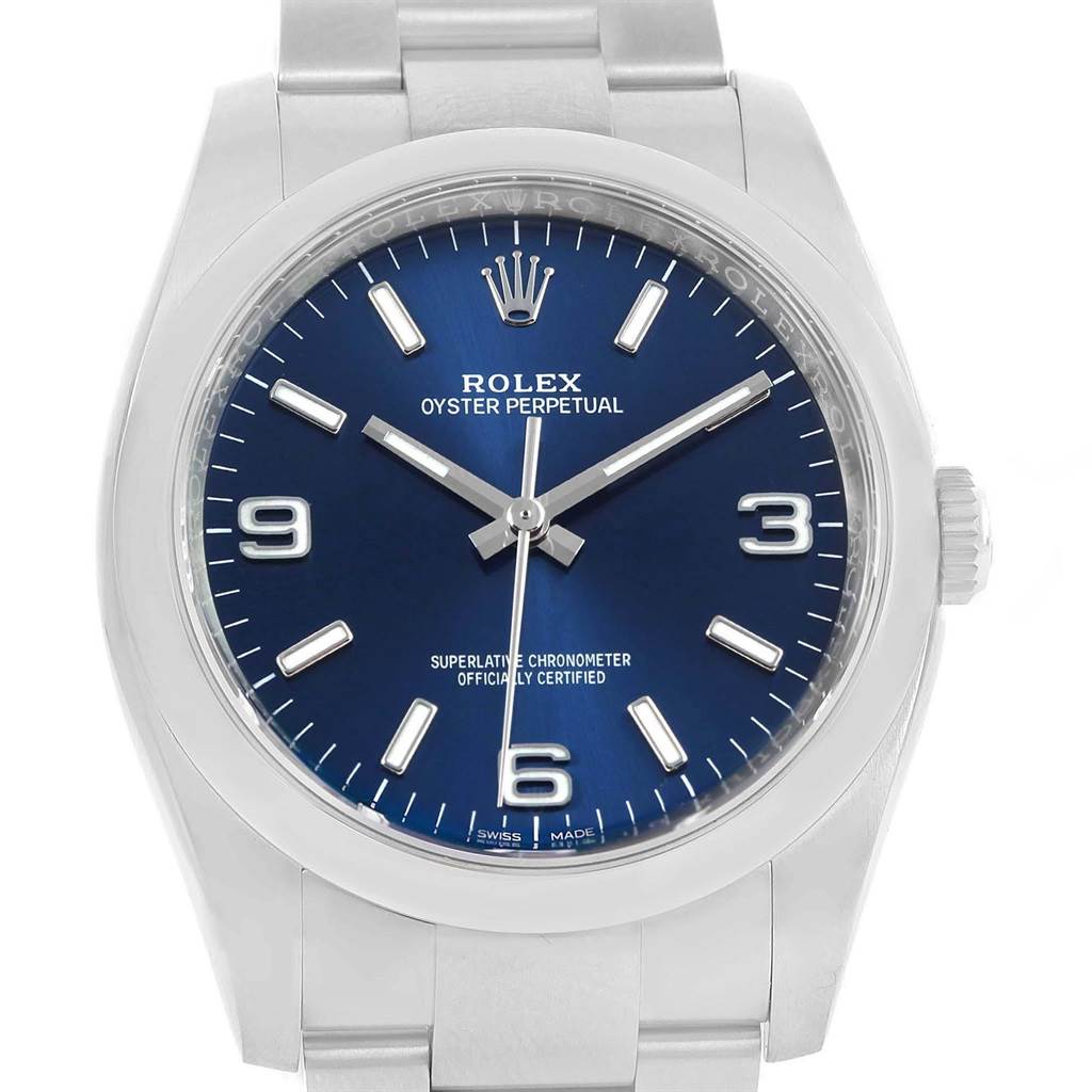 The image shows a front view of a Rolex Oyster Perpetual 116000 Men
s Stainless Steel Blue Dial 116000 Men
s Stainless Steel Blue Dial watch, displaying its dial, hands, hour markers, case, and strap.
