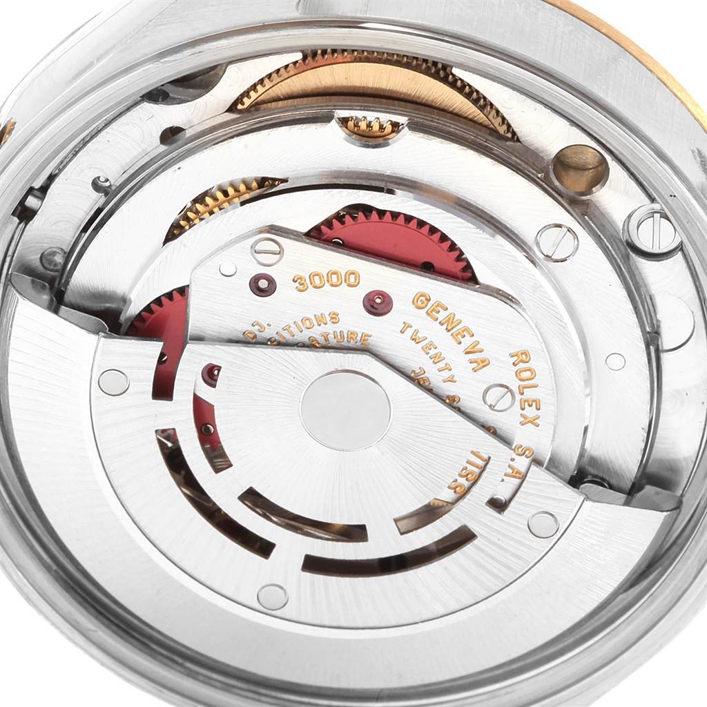 This image shows the movement mechanism of a Rolex Oyster Perpetual 14233 Men's Steel and Gold (two tone) Silver Dial 14233 Men's Steel and Gold (two tone) Silver Dial watch, viewed from the rear side.
