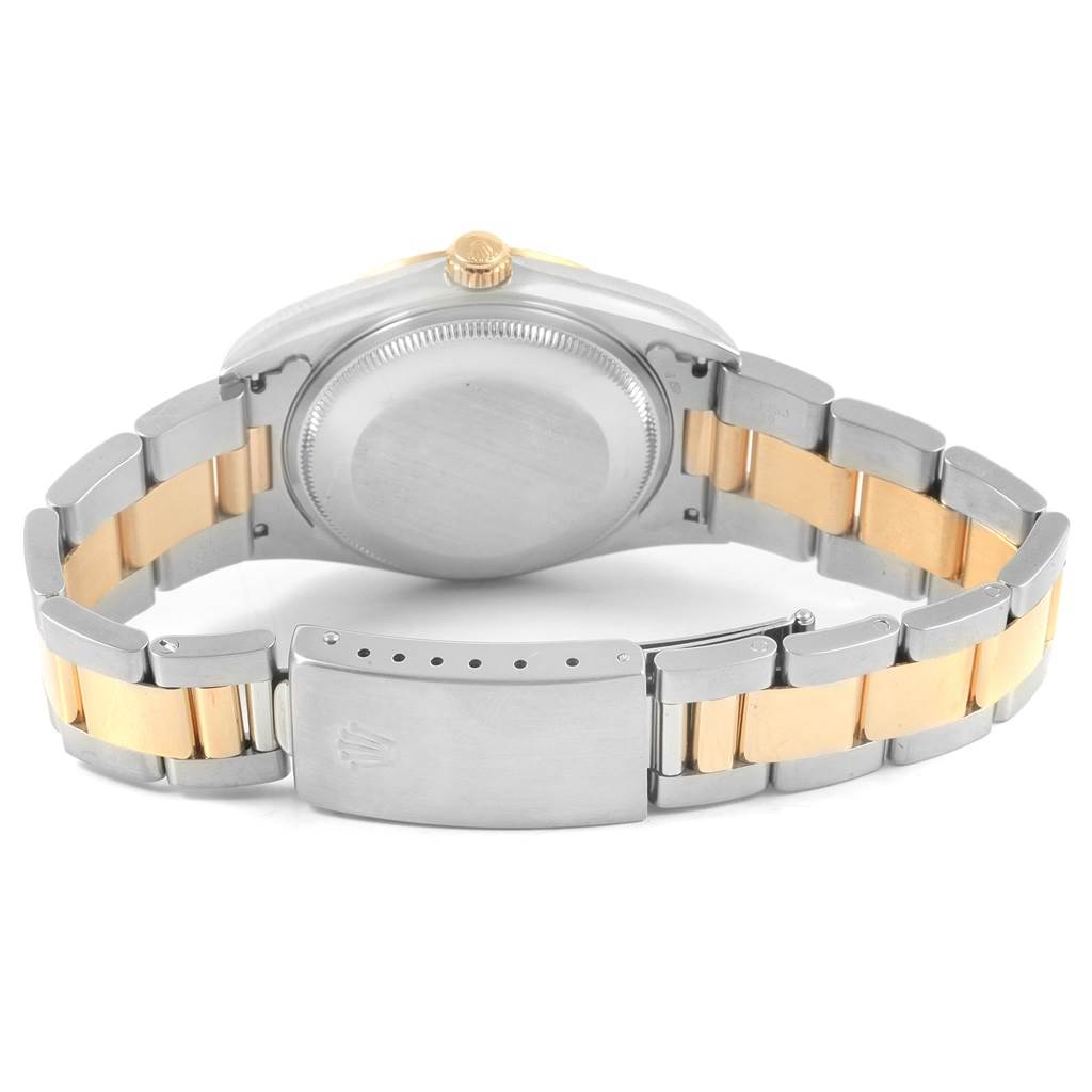 The image shows the back view of a Rolex Oyster Perpetual 14233 Men's Steel and Gold (two tone) Silver Dial 14233 Men's Steel and Gold (two tone) Silver Dial watch, highlighting the case back and two-tone bracelet with a clasp.