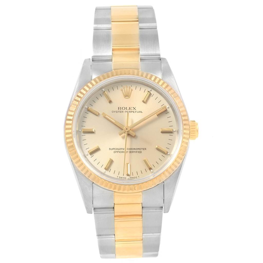 The image shows a front view of the Rolex Oyster Perpetual 14233 Men's Steel and Gold (two tone) Silver Dial 14233 Men's Steel and Gold (two tone) Silver Dial watch, highlighting the dial, bracelet, and crown.