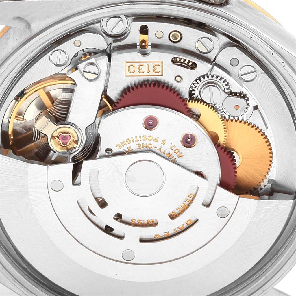 This image shows the detailed movement mechanism of a Rolex Oyster Perpetual 14233 Men's Steel and Gold (two tone) Silver Dial 14233 Men's Steel and Gold (two tone) Silver Dial watch.