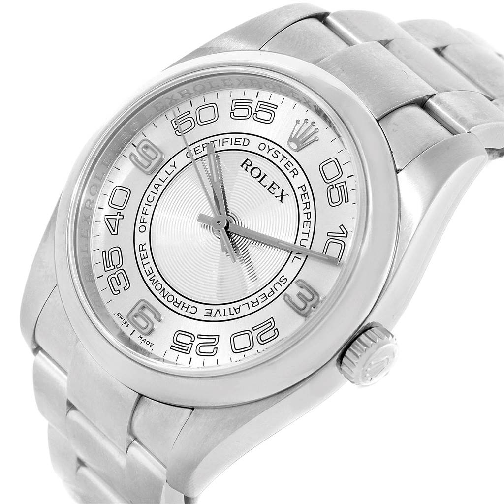 The image shows a close-up, angled view of the Rolex Oyster Perpetual 116000 Men
s Stainless Steel Silver Dial 116000 Men
s Stainless Steel Silver Dial watch, highlighting its dial, case, crown, and bracelet.