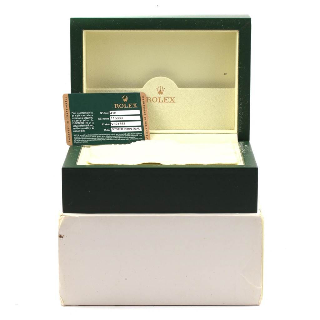 The image shows a Rolex Oyster Perpetual 116000 Men
s Stainless Steel Silver Dial 116000 Men
s Stainless Steel Silver Dial watch box with the guarantee card displayed, shot from the front.