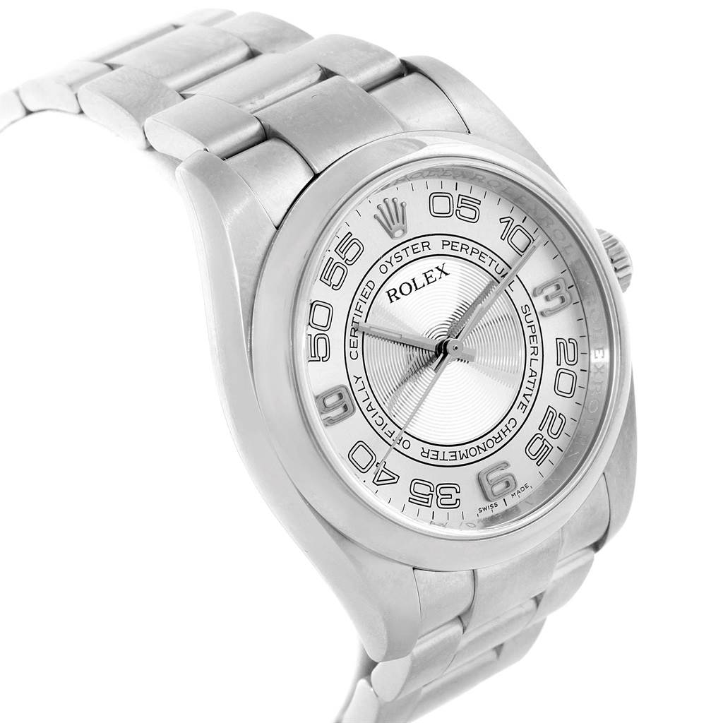 The image shows the face and top portion of the bracelet of a Rolex Oyster Perpetual 116000 Men
s Stainless Steel Silver Dial 116000 Men
s Stainless Steel Silver Dial watch from a slightly tilted angle.