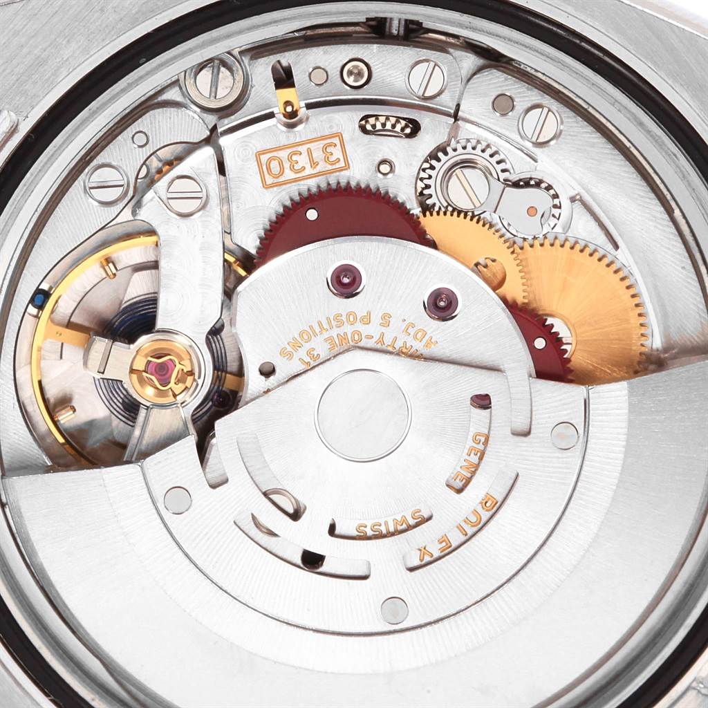 The image shows the inner mechanical movement of the Rolex Oyster Perpetual 116000 Men
s Stainless Steel Grey Dial 116000 Men
s Stainless Steel Grey Dial watch from a close-up angle.