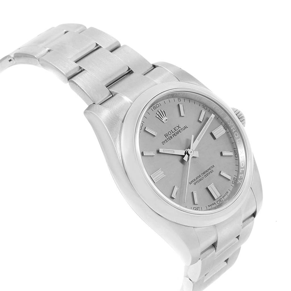 The image shows a Rolex Oyster Perpetual 116000 Men
s Stainless Steel Grey Dial 116000 Men
s Stainless Steel Grey Dial watch from a three-quarter angle, highlighting the dial, bezel, and stainless steel bracelet.