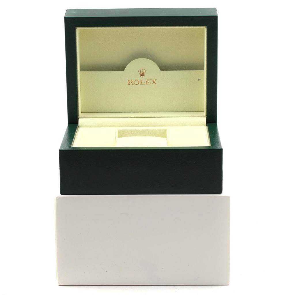 This image shows the open rectangular box for a Rolex Oyster Perpetual 116000 Men
s Stainless Steel Grey Dial 116000 Men
s Stainless Steel Grey Dial watch, revealing its cream interior and the Rolex logo.