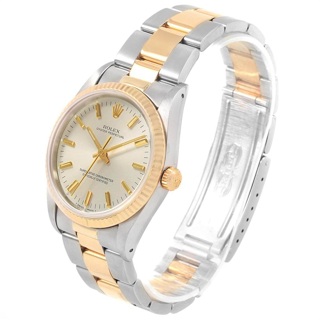 The image shows a Rolex Oyster Perpetual 14233 Men
s Steel and Gold (two tone) Silver Dial 14233 Men
s Steel and Gold (two tone) Silver Dial wristwatch at a three-quarter angle, highlighting the bezel, dial, and two-tone bracelet.