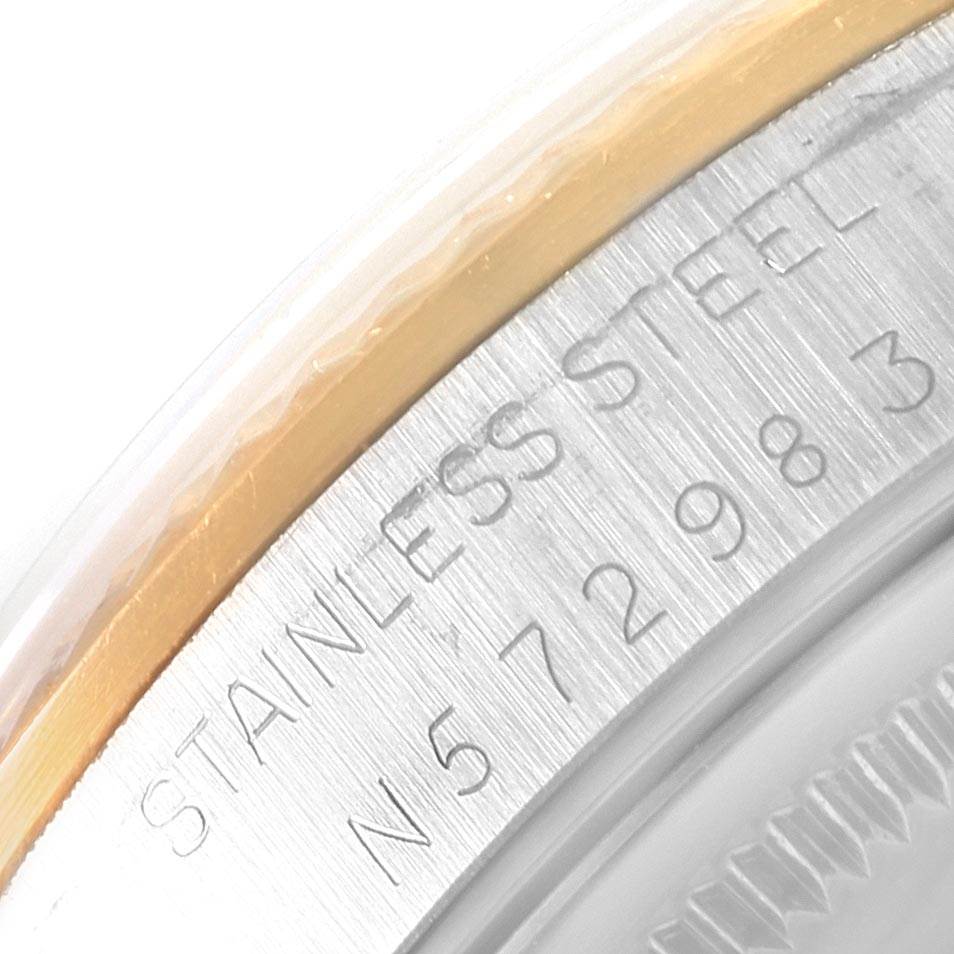 The image shows a close-up of the engravings on the stainless steel case of the Rolex Oyster Perpetual 14233 Men
s Steel and Gold (two tone) Silver Dial 14233 Men
s Steel and Gold (two tone) Silver Dial watch.