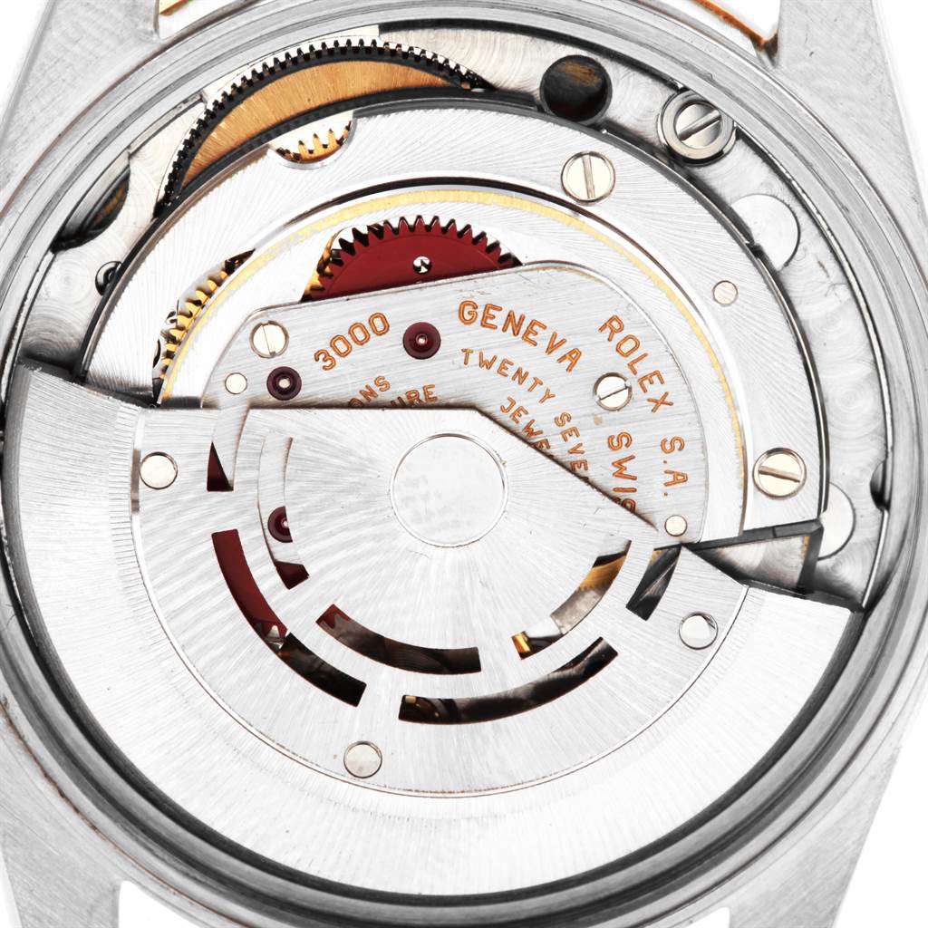 The image shows a close-up of the movement mechanism of a Rolex Oyster Perpetual 14233 Men
s Steel and Gold (two tone) Silver Dial 14233 Men
s Steel and Gold (two tone) Silver Dial watch.
