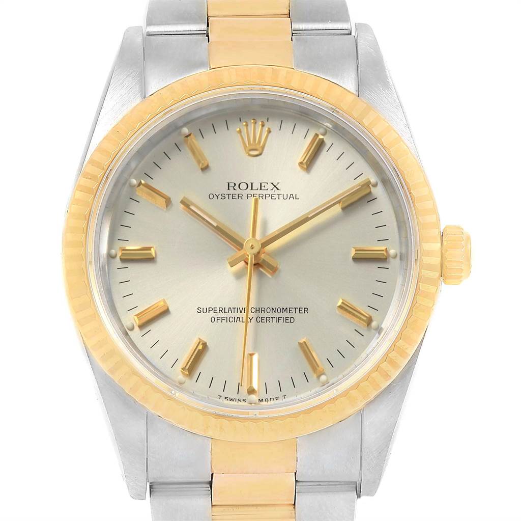 The image shows a Rolex Oyster Perpetual 14233 Men
s Steel and Gold (two tone) Silver Dial 14233 Men
s Steel and Gold (two tone) Silver Dial watch from a frontal angle, displaying the dial, hands, bezel, and part of the bracelet.