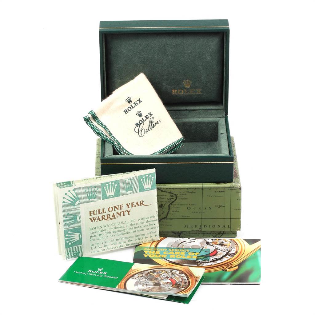 The image shows the box and accessories of a Rolex Oyster Perpetual 14233 Men
s Steel and Gold (two tone) Silver Dial 14233 Men
s Steel and Gold (two tone) Silver Dial watch, including the warranty card and booklets.