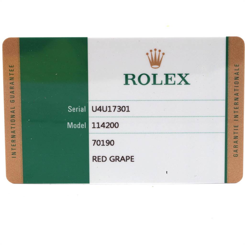 This image shows the warranty card for a Rolex Oyster Perpetual 114200 Men's Stainless Steel Burgundy Dial 114200 Men's Stainless Steel Burgundy Dial model 114200 in Red Grape.