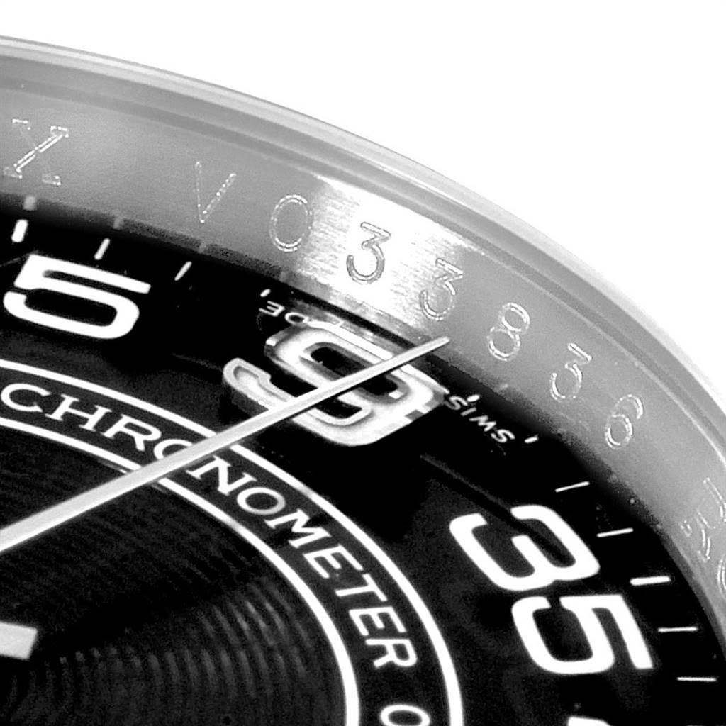 This image shows a close-up of the dial and bezel of a Rolex Oyster Perpetual 116000 Men's Stainless Steel Black Dial 116000 Men's Stainless Steel Black Dial watch, highlighting the numerals and part of the second hand.