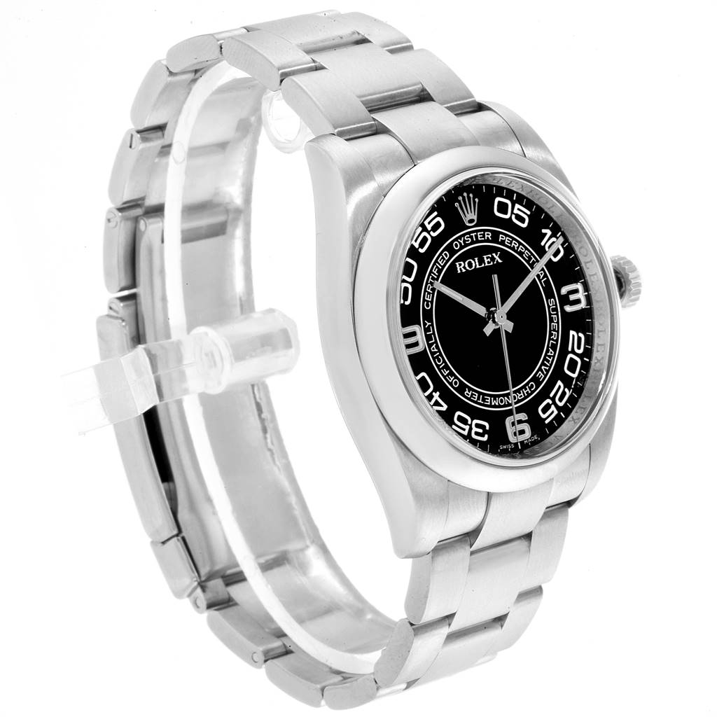 The Rolex Oyster Perpetual 116000 Men's Stainless Steel Black Dial 116000 Men's Stainless Steel Black Dial watch is shown at a slight angle, displaying the face, bezel, case, and part of the bracelet.