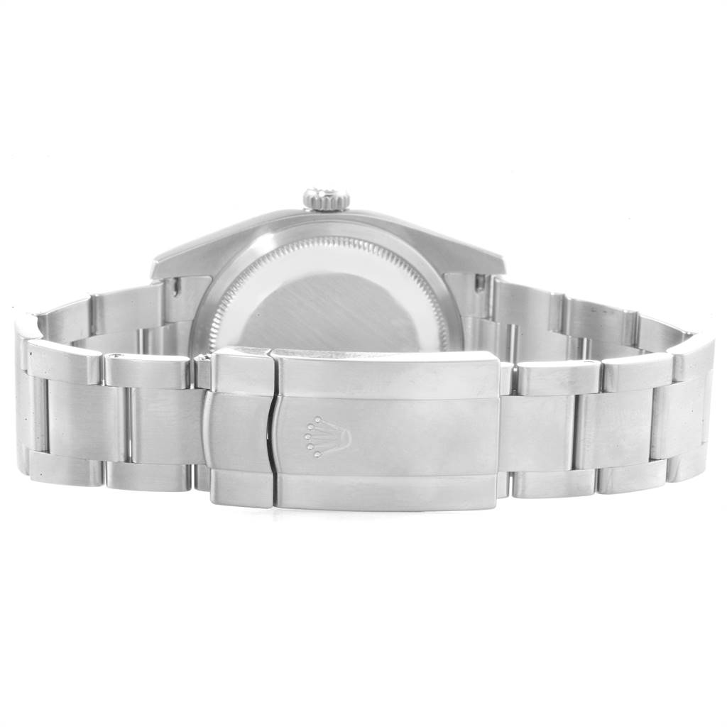 The image shows the back view of a Rolex Oyster Perpetual 116000 Men's Stainless Steel Black Dial 116000 Men's Stainless Steel Black Dial watch, including the case back and clasp.