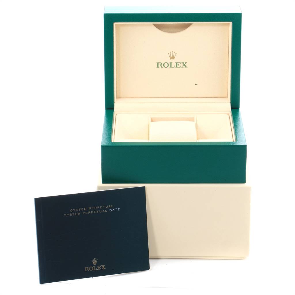 The image shows the open green case and warranty booklet for a Rolex Oyster Perpetual 116000 Men's Stainless Steel Black Dial 116000 Men's Stainless Steel Black Dial watch.