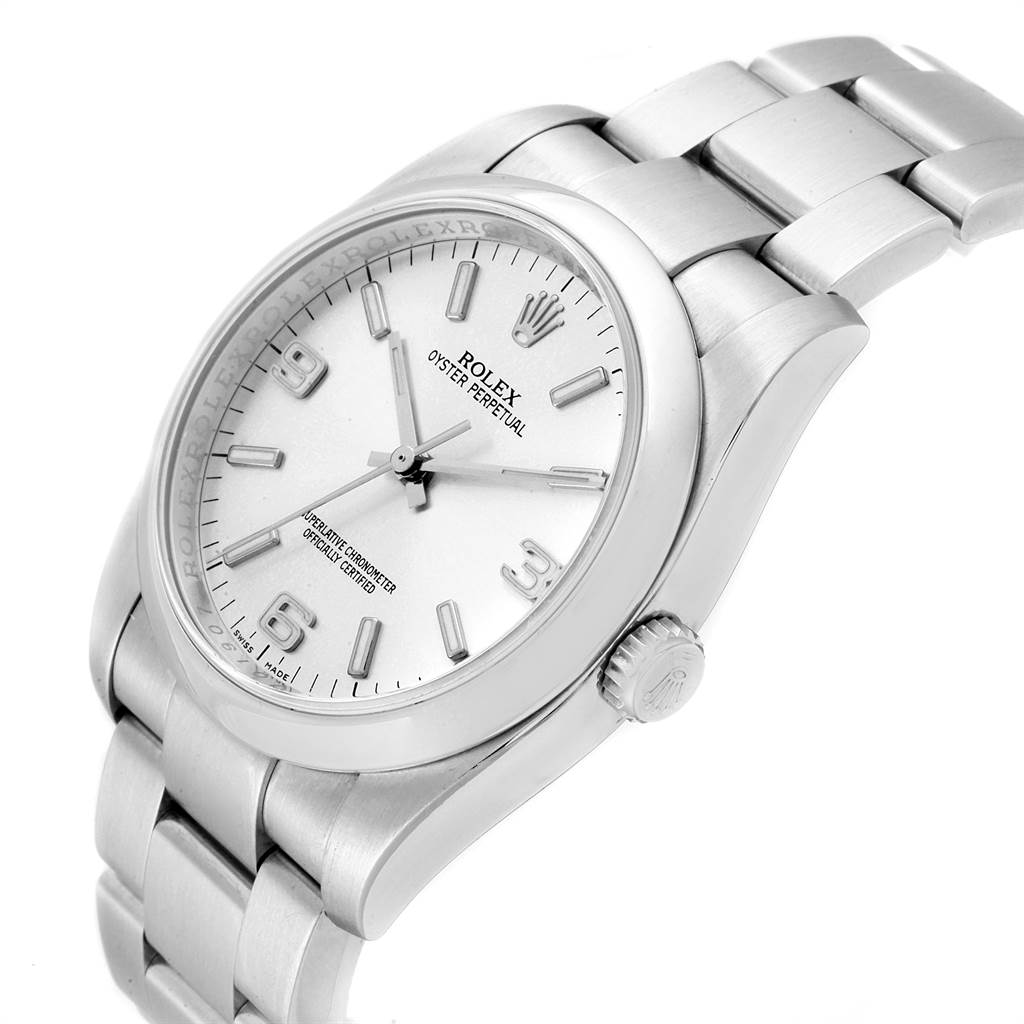 This Rolex Oyster Perpetual 116000 Men
s Stainless Steel Silver Dial 116000 Men
s Stainless Steel Silver Dial watch is shown at an angle highlighting the face, bezel, crown, and bracelet.