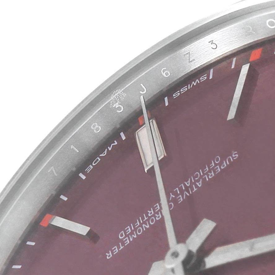 The image shows a close-up angle of the Oyster Perpetual watch by Rolex, highlighting part of the dial with hour markers, minute track, and hands.