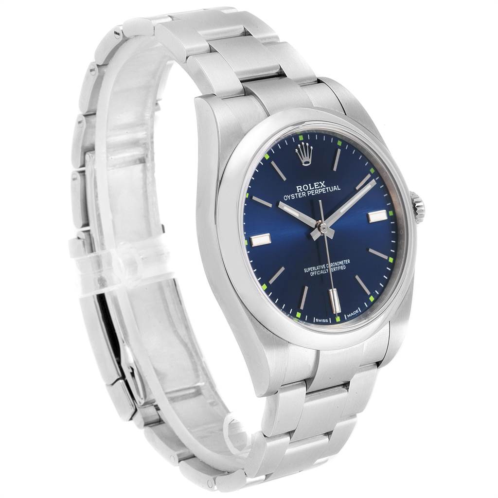 The image shows a side-angle view of the Rolex Oyster Perpetual 114300 Men
s Stainless Steel Blue Dial 114300 Men
s Stainless Steel Blue Dial watch, highlighting its blue dial and stainless steel bracelet.