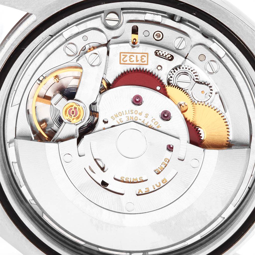 This is a close-up of the internal mechanism of a Rolex Oyster Perpetual 114300 Men
s Stainless Steel Blue Dial 114300 Men
s Stainless Steel Blue Dial watch, showing gears and components.