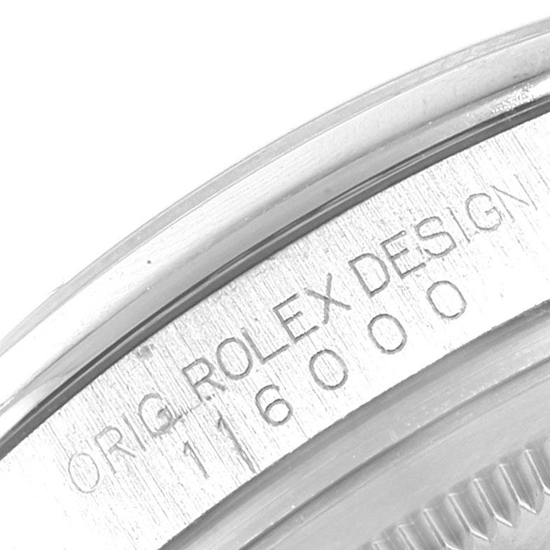 This image shows a close-up of the engraved case back and edge of the bracelet of a Rolex Oyster Perpetual 116000 Men
s Stainless Steel Blue Dial 116000 Men
s Stainless Steel Blue Dial 116000 model.