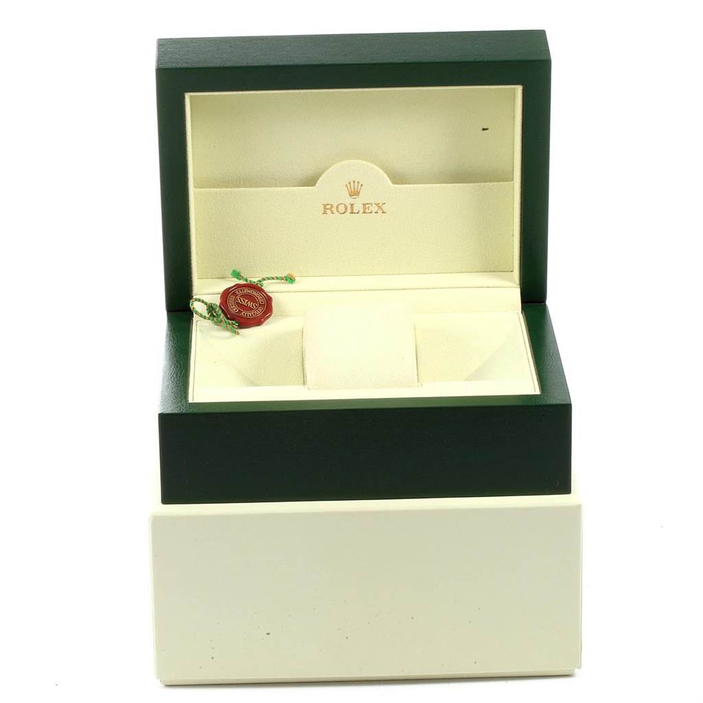 The image shows an open Rolex Oyster Perpetual 116000 Men
s Stainless Steel Blue Dial 116000 Men
s Stainless Steel Blue Dial watch box, revealing an empty interior and a Rolex tag.