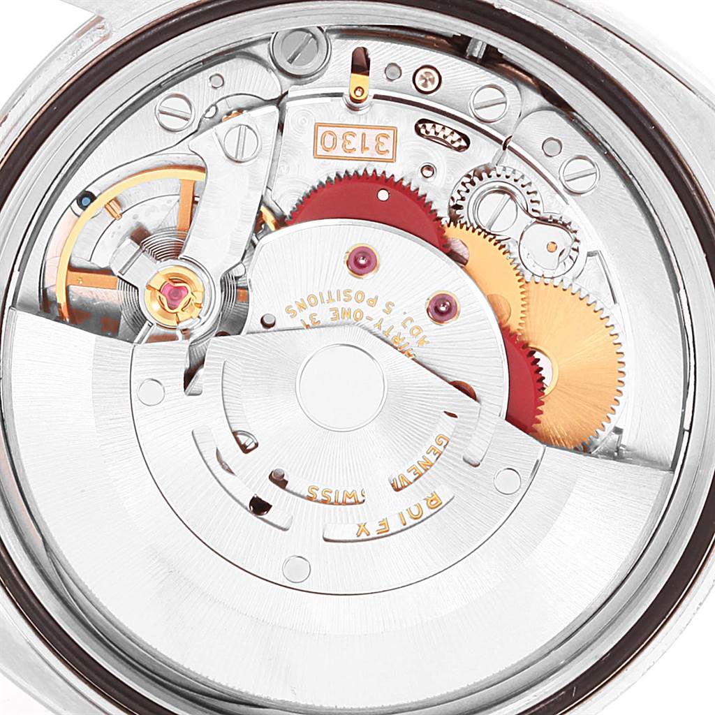 This image shows the inner mechanical movement of the Rolex Oyster Perpetual 116000 Men
s Stainless Steel Silver Dial 116000 Men
s Stainless Steel Silver Dial watch at a top-down angle, highlighting gears and components.